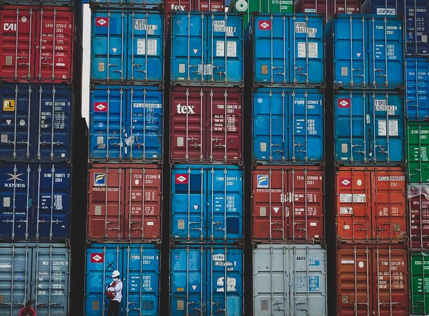 Stacked containers at an ocean terminal handling Asia–Europe and trans-Pacific cargo